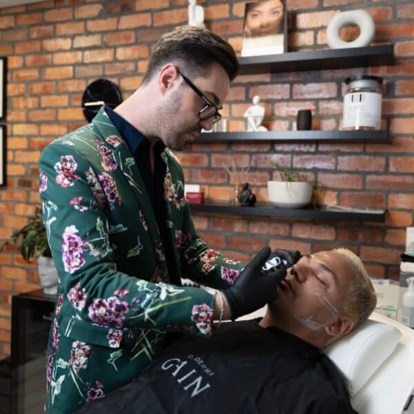 Dr Juan Bester performing a Botox treatment on a patient at LightSculpt medical aesthetics clinic in Green Point, Cape Town